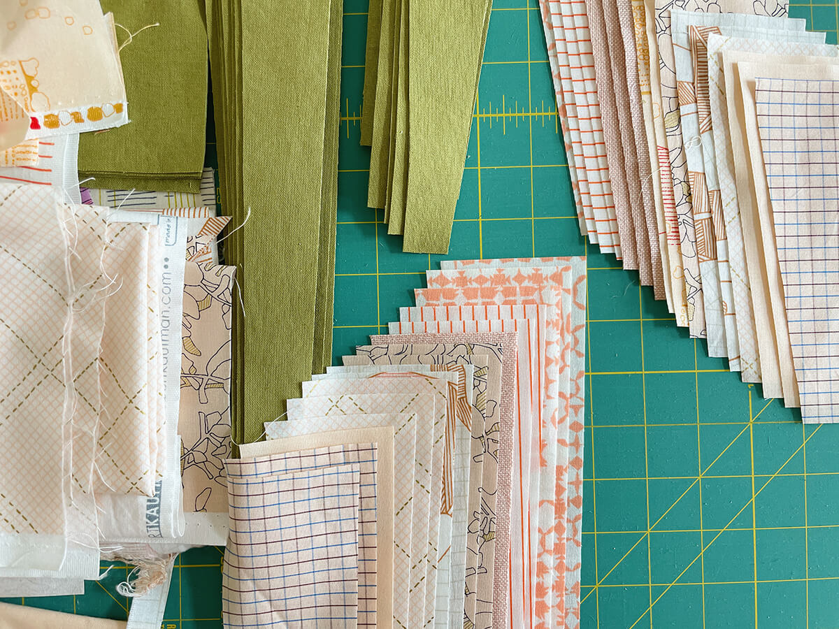 slash quilt cuttings in peaches and jungle green